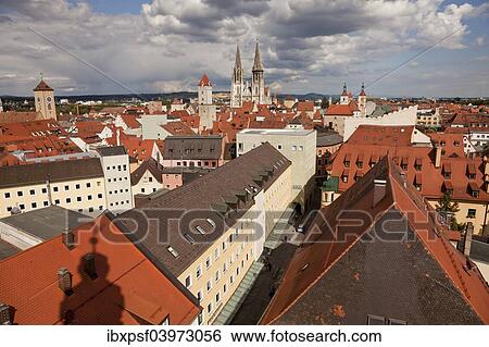 Stock Photograph - "Rooftops of the historic centre with the clock tower of Old Town Hall and Regensburg Cathedral, Regensburg, Bavaria, Germany, Europe". Fotosearch