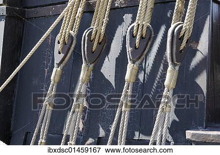 Stock Photo - Ropes and pulleys on a ship. Fotosearch