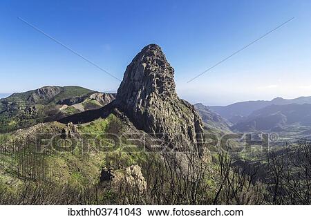 "Roque de Agando rock in the Garajonay National Park, La Gomera, Canary Islands, Spain, Europe" View Large Photo Image Stock Image - "Roque de Agando rock in the Garajonay National Park, La Gomera, Canary Islands, Spain, Europe". Fotosearch