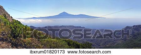 "Roque de Agando with Tenerife in the distance, La Gomera, Canary Islands, Spain, Europe" View Large Photo Image Stock Image - "Roque de Agando with Tenerife in the distance, La Gomera, Canary Islands, Spain, Europe". Fotosearch