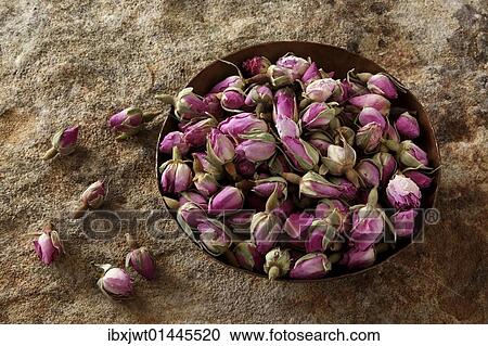 Rose buds (Rosa) in a copper bowl on a stone surface View Large Photo Image Stock Image - Rose buds (Rosa) in a copper bowl on a stone surface. Fotosearch