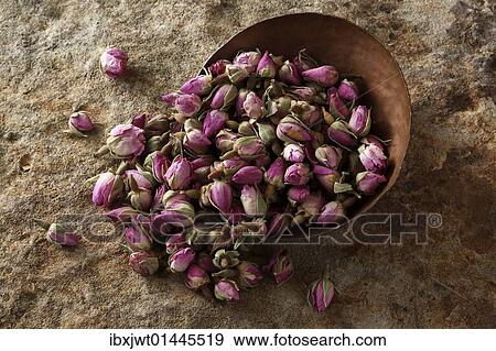 Rose buds (Rosa) in a copper bowl on a stone surface View Large Photo Image Stock Photo - Rose buds (Rosa) in a copper bowl on a stone surface. Fotosearch