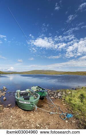 "Row boats on the shores of Loch Meadi, Altnaharra, Northern Highlands, Scotland, United Kingdom, Europe" View Large Photo Image Stock Image - "Row boats on the shores of Loch Meadi, Altnaharra, Northern Highlands, Scotland, United Kingdom, Europe". Fotosearch