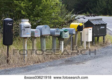 Stock Photo - "Row of different mailboxes on the roadside, Seacliff, Otago Region, New Zealand, Oceania". Fotosearch