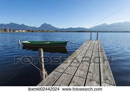 "Rowing boat with jetty on the shore of Hopfensee Lake near Fuessen, Ostallgaeu region, Allgaeu, Bavaria, Germany, Europe" View Large Photo Image Picture - "Rowing boat with jetty on the shore of Hopfensee Lake near Fuessen, Ostallgaeu region, Allgaeu, Bavaria, Germany, Europe". Fotosearch
