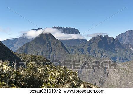 "Rugged mountains with a band of clouds, seen from La Roche Ecrite, Cirque de Mafate, Reunion" View Large Photo Image Stock Image - "Rugged mountains with a band of clouds, seen from La Roche Ecrite, Cirque de Mafate, Reunion". Fotosearch