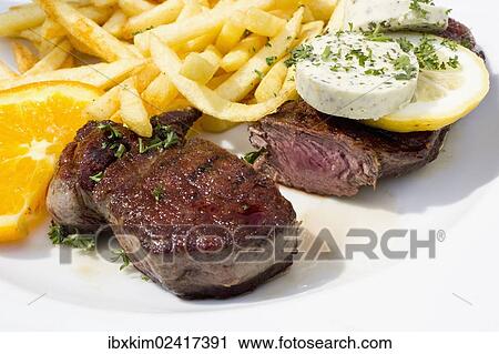 "Rump steak, cut, medium, with herbed butter and french fries" View Large Photo Image Stock Image - "Rump steak, cut, medium, with herbed butter and french fries". Fotosearch