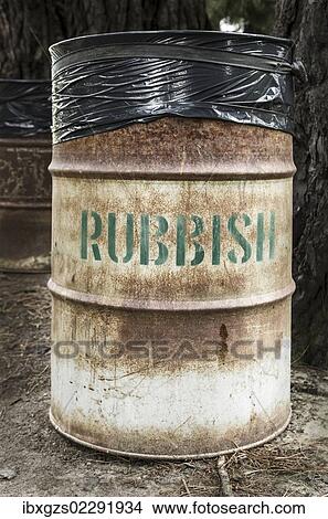 Picture - "Rusty tin rubbish bin with word """"rubbish"""", New Zealand, Oceania". Fotosearch