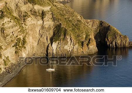 Picture - "Sailboat in the bay of the Valle Muria, Lipari island, Sicily, Italy, Europe". Fotosearch