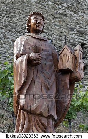 "Saint Goar with wine glass and church, carved statue, St. Goar, Unesco World Heritage Upper Middle Rhine Valley, Rhineland-Palatinate, Germany, Europe" View Large Photo Image Stock Image - "Saint Goar with wine glass and church, carved statue, St. Goar, Unesco World Heritage Upper Middle Rhine Valley, Rhineland-Palatinate, Germany, Europe". Fotosearch