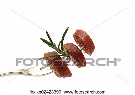 Salami slices on a fork with rosemary View Large Photo Image Stock Photo - Salami slices on a fork with rosemary. Fotosearch