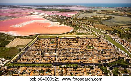 "Salines and the historic centre in the quadrilateral of Aigues-Mortes, Camargue, Languedoc-Roussillon, France, Europe" View Large Photo Image Stock Photography - "Salines and the historic centre in the quadrilateral of Aigues-Mortes, Camargue, Languedoc-Roussillon, France, Europe". Fotosearch