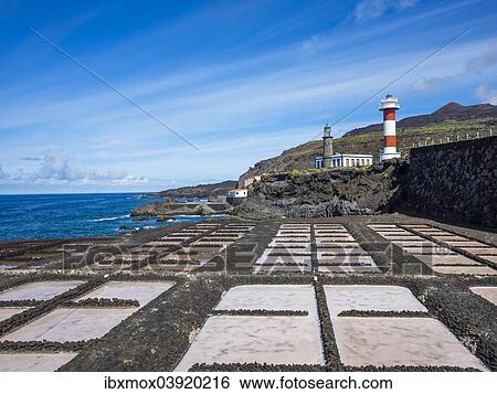Stock Photograph - "Salt production, Teneguia salt pans, old and new lighthouse at Faro de Fuencaliente, Los Quemados, south coast, La Palma, Canary Islands, Spain, Europe". Fotosearch
