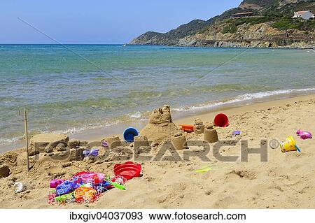 "Sand castle and beach toys on the beach, Portixeddu, Province of Carbonia-Iglesias, Sardinia, Italy, Europe" View Large Photo Image Stock Image - "Sand castle and beach toys on the beach, Portixeddu, Province of Carbonia-Iglesias, Sardinia, Italy, Europe". Fotosearch