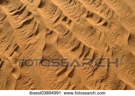 Stock Image - "Sand ripples, texture on a sand dune, Tassili n'Ajjer, Sahara desert, Algeria, Africa". Fotosearch