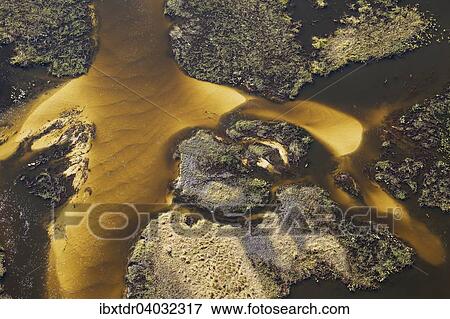 Stock Photo - "Sandy section of the Gomoti River with its channels and islands, aerial view, Okavango Delta, Botswana, Africa". Fotosearch