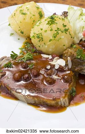 "Sauerbraten, marinated pot roast with potato dumplings" View Large Photo Image Stock Photography - "Sauerbraten, marinated pot roast with potato dumplings". Fotosearch
