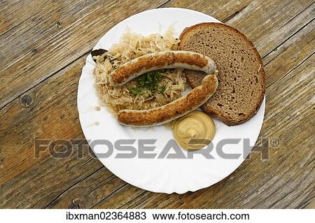 "Sausages with sauerkraut and bread, Berggasthaus Hoess mountain guesthouse on Hutterer Hoess Mountain, Totes Gebirge Range, Pyhrn-Priel region, Traunviertel district, Upper Austria, Austria, Europe" View Large Photo Image Stock Image - "Sausages with sauerkraut and bread, Berggasthaus Hoess mountain guesthouse on Hutterer Hoess Mountain, Totes Gebirge Range, Pyhrn-Priel region, Traunviertel district, Upper Austria, Austria, Europe". Fotosearch
