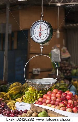 Stock Image - "Scales with a bowl for fruit at a market, Chiclayo, Lambayeque, Peru, South America". Fotosearch
