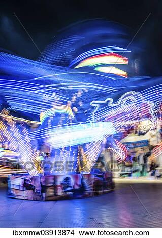 "Scattered light trails from a fairground ride at night, Munich Spring Festival, Theresienwiese, Munich, Bavaria, Germany, Europe" View Large Photo Image Picture - "Scattered light trails from a fairground ride at night, Munich Spring Festival, Theresienwiese, Munich, Bavaria, Germany, Europe". Fotosearch