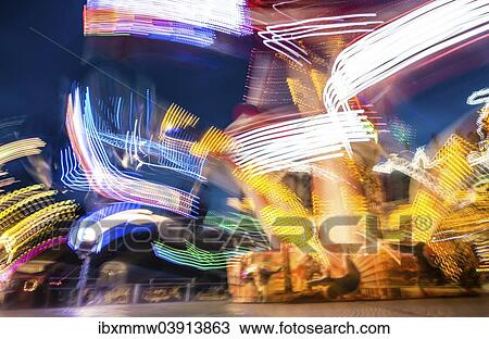 "Scattered light trails from a fairground ride at night, Munich Spring Festival, Theresienwiese, Munich, Bavaria, Germany, Europe" View Large Photo Image Stock Image - "Scattered light trails from a fairground ride at night, Munich Spring Festival, Theresienwiese, Munich, Bavaria, Germany, Europe". Fotosearch