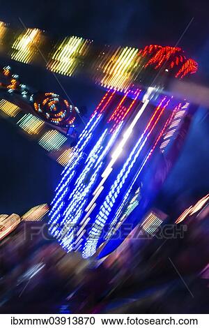 "Scattered light trails from a fairground ride at night, Munich Spring Festival, Theresienwiese, Munich, Bavaria, Germany, Europe" View Large Photo Image Stock Image - "Scattered light trails from a fairground ride at night, Munich Spring Festival, Theresienwiese, Munich, Bavaria, Germany, Europe". Fotosearch
