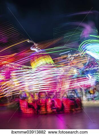"Scattered light trails from a fairground ride at night, Munich Spring Festival, Theresienwiese, Munich, Bavaria, Germany, Europe" View Large Photo Image Stock Image - "Scattered light trails from a fairground ride at night, Munich Spring Festival, Theresienwiese, Munich, Bavaria, Germany, Europe". Fotosearch