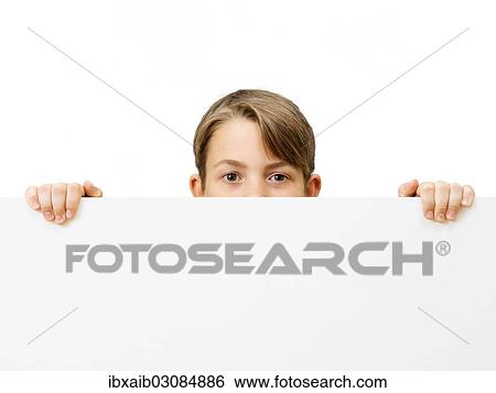 "Schoolboy behind a white board, half hidden" View Large Photo Image Stock Photograph - "Schoolboy behind a white board, half hidden". Fotosearch