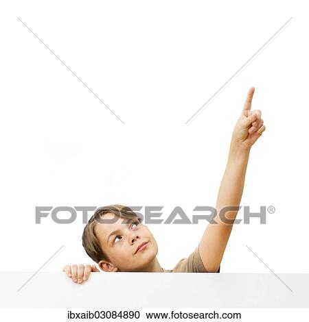 "Schoolboy behind a white board, pointing up" View Large Photo Image Stock Image - "Schoolboy behind a white board, pointing up". Fotosearch
