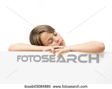 "Schoolboy behind a white board, sleeping" View Large Photo Image Stock Photography - "Schoolboy behind a white board, sleeping". Fotosearch