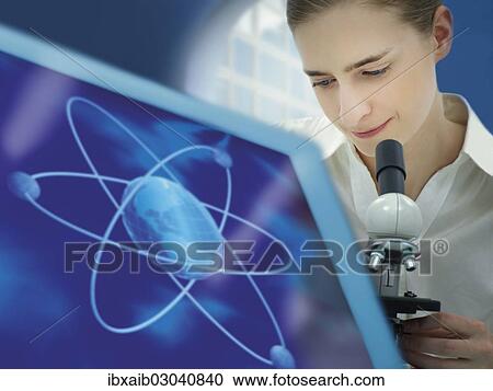 "Scientist using a microscope, atomic structure on a monitor" View Large Photo Image Stock Image - "Scientist using a microscope, atomic structure on a monitor". Fotosearch