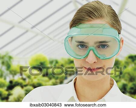 Scientist wearing a protective mask in a greenhouse View Large Photo Image Stock Image - Scientist wearing a protective mask in a greenhouse. Fotosearch
