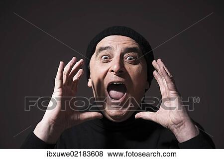 Screaming elderly man wearing a black woollen hat View Large Photo Image Stock Photo - Screaming elderly man wearing a black woollen hat. Fotosearch