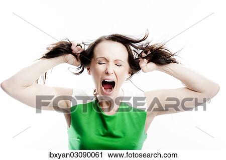 Screaming woman tearing at her own hair View Large Photo Image Stock Image - Screaming woman tearing at her own hair. Fotosearch