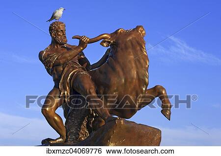 "Sculpture of Hercules wrestling with the Cretan bull, palace gardens of the Schweriner Schloss castle, Schwerin, Mecklenburg-Western Pomerania, Germany, Europe" View Large Photo Image Stock Photograph - "Sculpture of Hercules wrestling with the Cretan bull, palace gardens of the Schweriner Schloss castle, Schwerin, Mecklenburg-Western Pomerania, Germany, Europe". Fotosearch