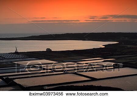 "Sea salt production, saltworks, Salinas de Janubio, sunset, Lanzarote, Canary Islands, Spain, Europe" View Large Photo Image Stock Photograph - "Sea salt production, saltworks, Salinas de Janubio, sunset, Lanzarote, Canary Islands, Spain, Europe". Fotosearch