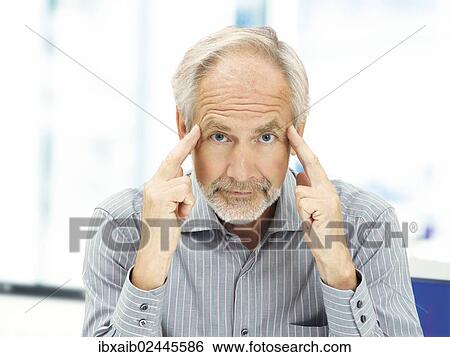 Stock Photograph - "Senior, concentrating expression". Fotosearch