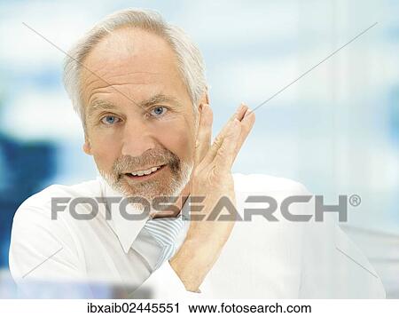 "Senior, talking behind his hand, off the record" View Large Photo Image Stock Image - "Senior, talking behind his hand, off the record". Fotosearch