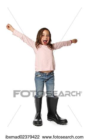 Seven-year-old girl with too big rubber boots View Large Photo Image Stock Image - Seven-year-old girl with too big rubber boots. Fotosearch