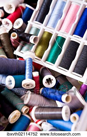 Stock Image - "Sewing threads, various colors". Fotosearch