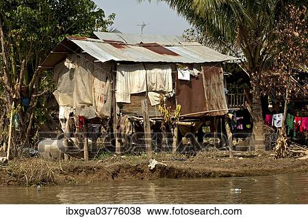 "Shack, corrugated iron hut at the Sangker River, near Battambang, Battambang Province, Cambodia, Asia" View Large Photo Image Stock Photo - "Shack, corrugated iron hut at the Sangker River, near Battambang, Battambang Province, Cambodia, Asia". Fotosearch