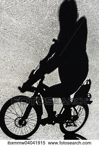 "Shadow of a cyclist, Bavaria, Germany, Europe" View Large Photo Image Stock Photography - "Shadow of a cyclist, Bavaria, Germany, Europe". Fotosearch