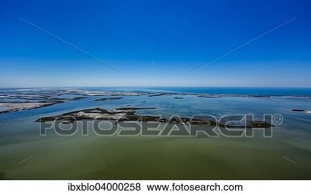 "Shallow water island, Saintes-Maries-de-la-Mer, Camargue, Provence-Alpes-Cote d'Azur, France, Europe" View Large Photo Image Stock Photo - "Shallow water island, Saintes-Maries-de-la-Mer, Camargue, Provence-Alpes-Cote d'Azur, France, Europe". Fotosearch