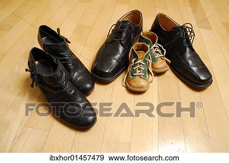 Stock Photo - "Shoes of a family, symbolic image for family". Fotosearch