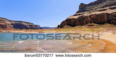 "Shore of Lake Powell, surrounded by red Navajo sandstone cliffs, rock formations, Page, Arizona, USA" View Large Photo Image Stock Photo - "Shore of Lake Powell, surrounded by red Navajo sandstone cliffs, rock formations, Page, Arizona, USA". Fotosearch
