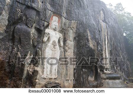 "Shrine of Mahayana Buddhism, three old Buddha statues as rock reliefs, Avalokiteshvara in white, larger Buddha on the right, Buduruvagala, Wellawaya, Monaragala Distrikt, Sri Lanka, Asia" View Large Photo Image Stock Photo - "Shrine of Mahayana Buddhism, three old Buddha statues as rock reliefs, Avalokiteshvara in white, larger Buddha on the right, Buduruvagala, Wellawaya, Monaragala Distrikt, Sri Lanka, Asia". Fotosearch