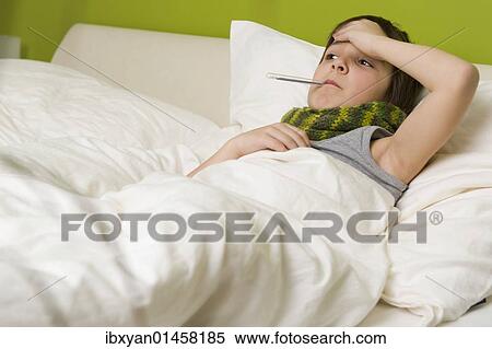 "Sick boy with fever in bed, thermometer" View Large Photo Image Stock Photography - "Sick boy with fever in bed, thermometer". Fotosearch