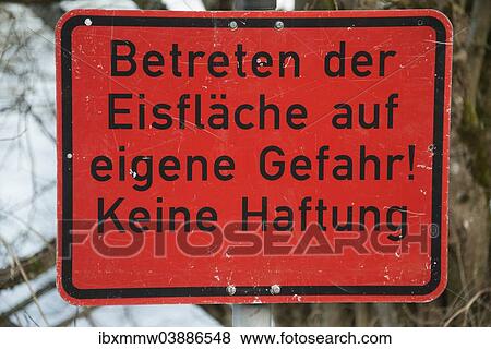 "Sign """"Betreten der Eisflache auf eigene Gefahr! Keine Haftung"""", German for """"frozen surface, enter at your own risk, no liability"""", black writing on red" View Large Photo Image Stock Photo - "Sign """"Betreten der Eisflache auf eigene Gefahr! Keine Haftung"""", German for """"frozen surface, enter at your own risk, no liability"""", black writing on red". Fotosearch