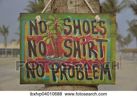 "Sign """"No shoes, no shirt, no problem"""" on the beach of Salalah Rotana Resort, Salalah, Dhofar Region, Oman, Asia" View Large Photo Image Stock Photo - "Sign """"No shoes, no shirt, no problem"""" on the beach of Salalah Rotana Resort, Salalah, Dhofar Region, Oman, Asia". Fotosearch