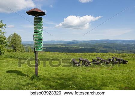 "Signsposts, distance markers, wooden benches and tables on Mt Dolmar with views of the Thuringian Forest, Thuringia, Germany, Europe" View Large Photo Image Stock Image - "Signsposts, distance markers, wooden benches and tables on Mt Dolmar with views of the Thuringian Forest, Thuringia, Germany, Europe". Fotosearch